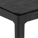 Black outdoor table with textured surface on a white background